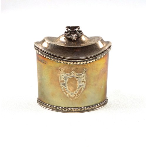 20 - Edwardian George III style silver tea caddy of navette form, with a central vacant cartouche between... 