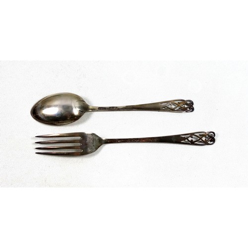 69 - George V silver 2 piece christening set comprising fork and spoon, each with a pieced handle, by A M... 