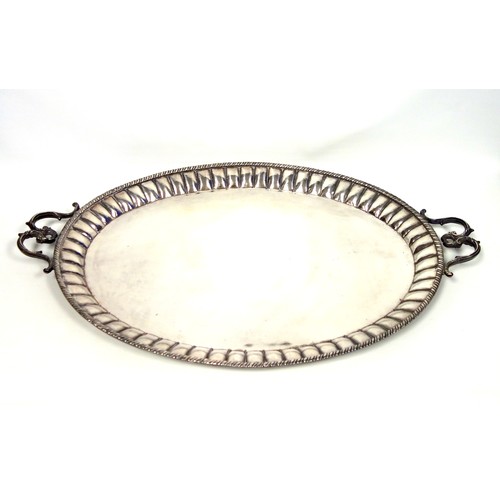 94 - Indian large silver plated oval tray with a fluted and gadrooned rim and 2 double scroll handles, W.... 