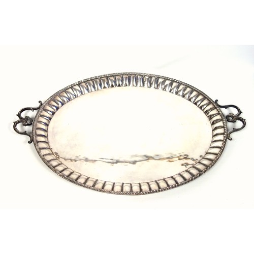 94 - Indian large silver plated oval tray with a fluted and gadrooned rim and 2 double scroll handles, W.... 