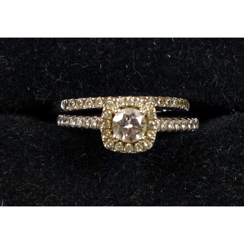 118 - 18k white gold and diamond Halo set engagement ring, size N, diamonds 0.69 carats approx., 3.7 grams... 