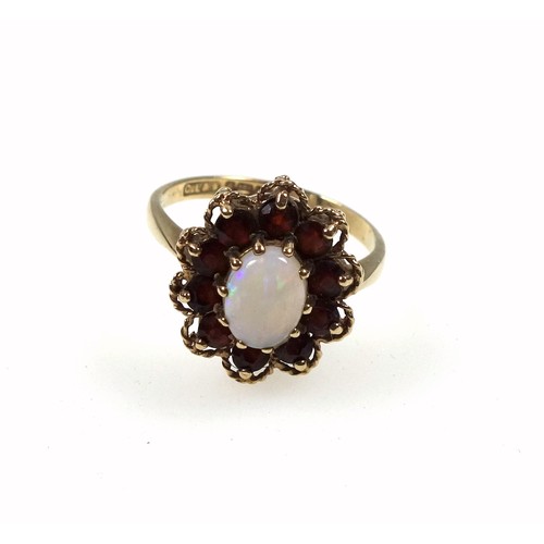 136 - 9ct gold opal and garnet ring, size Q 1/2, 3.8 grams