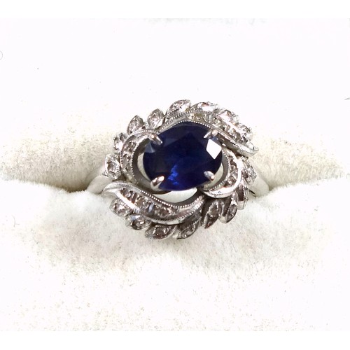 169 - White metal ring set sapphire and diamonds in a foliate design, size M 1/2, 3.6 grams, boxed (2)