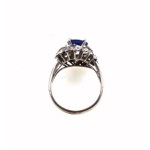 169 - White metal ring set sapphire and diamonds in a foliate design, size M 1/2, 3.6 grams, boxed (2)