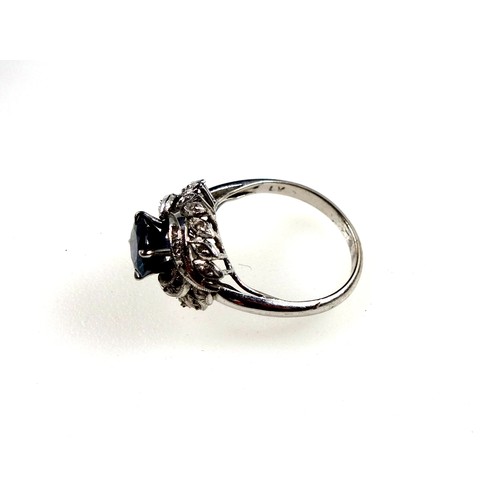 169 - White metal ring set sapphire and diamonds in a foliate design, size M 1/2, 3.6 grams, boxed (2)