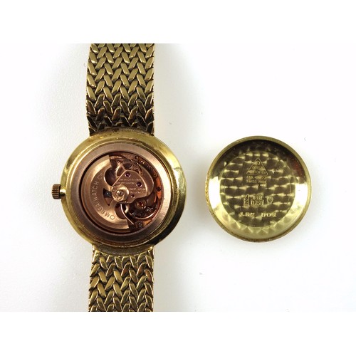 173 - A Lady's 18ct gold Omega automatic bracelet watch, with a circular shaped case, diameter 28mm overal... 