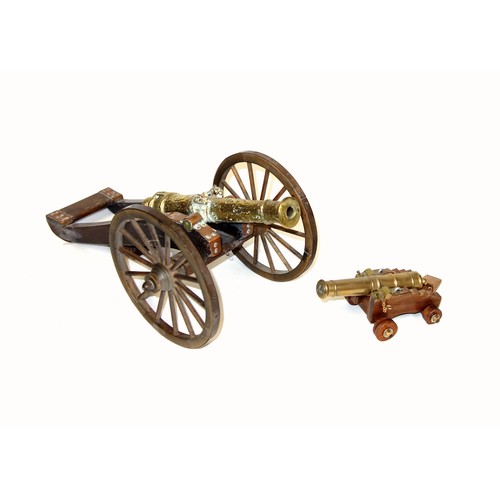 196 - Model of a brass 1647 cannon on a stained wood carriage with metal bound wheels, L.44cm, length of b... 