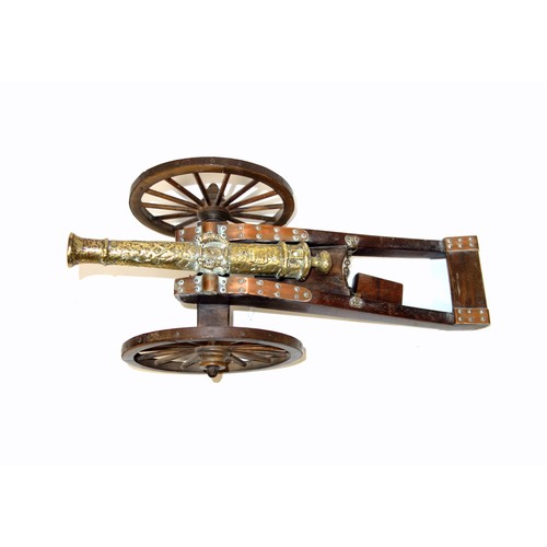 196 - Model of a brass 1647 cannon on a stained wood carriage with metal bound wheels, L.44cm, length of b... 