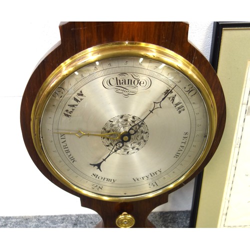 215 - Victorian wheel barometer with a silvered dial, thermometer and hygrometer above, spirit level below... 