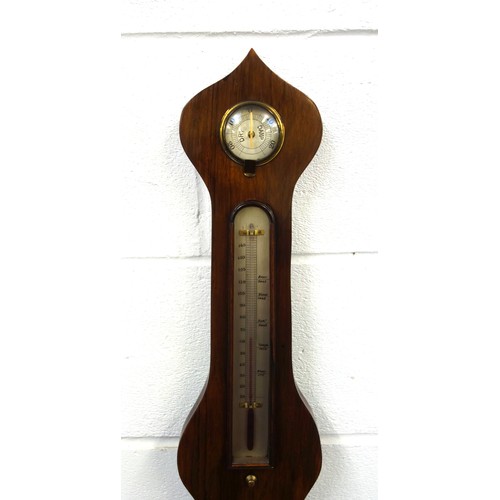 215 - Victorian wheel barometer with a silvered dial, thermometer and hygrometer above, spirit level below... 