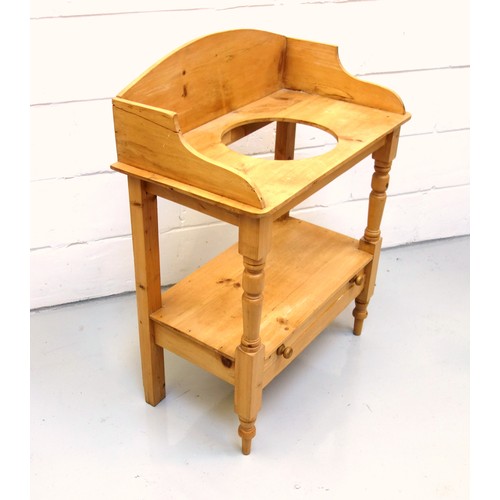 225 - Late Victorian pine washstand with an arched galleried back, undertier and drawer below, on semi tur... 