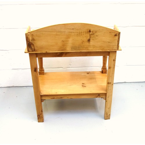 225 - Late Victorian pine washstand with an arched galleried back, undertier and drawer below, on semi tur... 