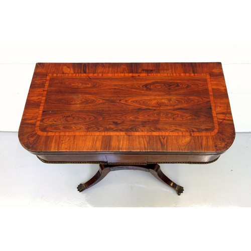 226 - George IV rosewood card table with a crossbanded rounded rectangular hinged top opening to a green b... 