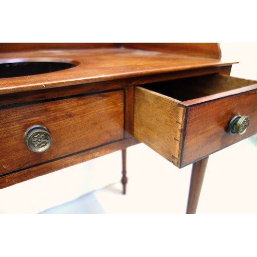 227 - George IV mahogany washstand with a galleried top above 2 drawers flanking a simulated drawer, on tu... 