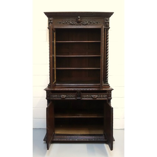 230 - 19th Century Flemish carved oak cabinet with 2 arch glazed panelled doors above, 2 drawers and 2 pan... 