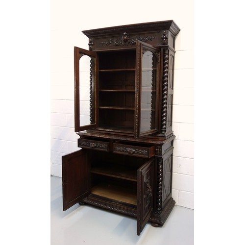 230 - 19th Century Flemish carved oak cabinet with 2 arch glazed panelled doors above, 2 drawers and 2 pan... 