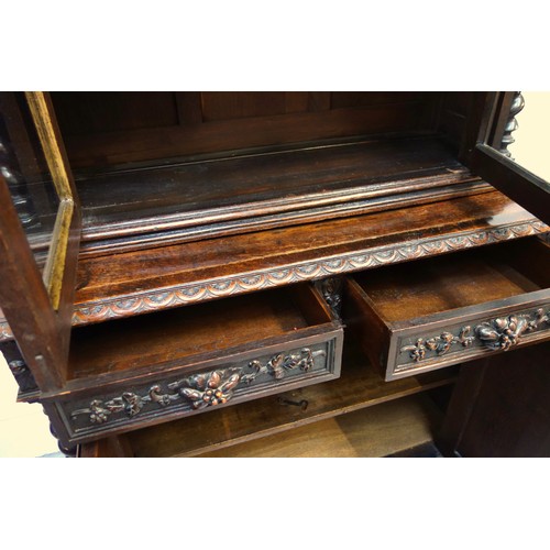 230 - 19th Century Flemish carved oak cabinet with 2 arch glazed panelled doors above, 2 drawers and 2 pan... 