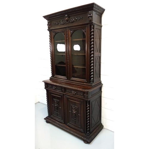 230 - 19th Century Flemish carved oak cabinet with 2 arch glazed panelled doors above, 2 drawers and 2 pan... 