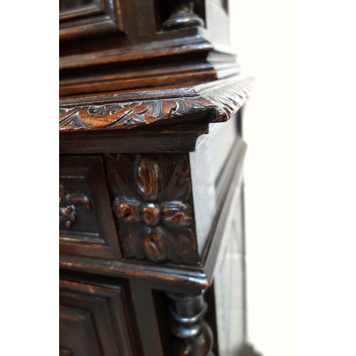 230 - 19th Century Flemish carved oak cabinet with 2 arch glazed panelled doors above, 2 drawers and 2 pan... 