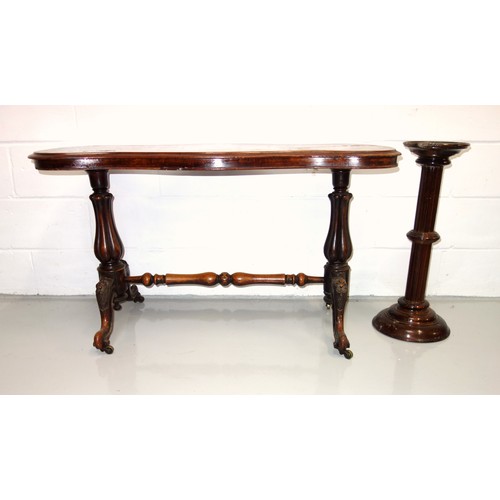 235 - Victorian walnut table with a serpentine rectangular top, on 2 bulbous columns, carved cabriole legs... 