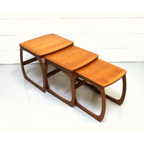 242 - Mid-Century Nathan teak nest of 3 tables, each with a rounded rectangular top on bowed legs, 50 x 52... 