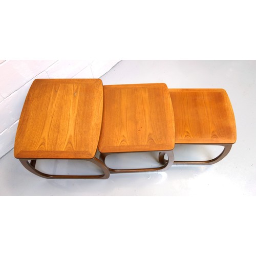 242 - Mid-Century Nathan teak nest of 3 tables, each with a rounded rectangular top on bowed legs, 50 x 52... 