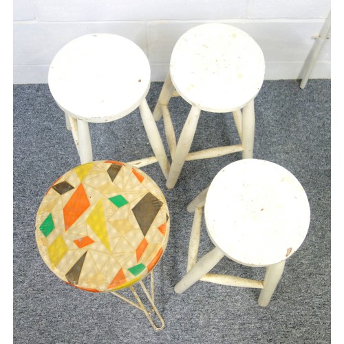 244 - A mid-century adjustable height stool with three metal legs and circular seat covered in a geometric... 