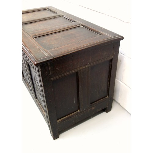 250 - 17th Century carved oak chest with a triple diamond panelled front and a hinged triple panelled top,... 