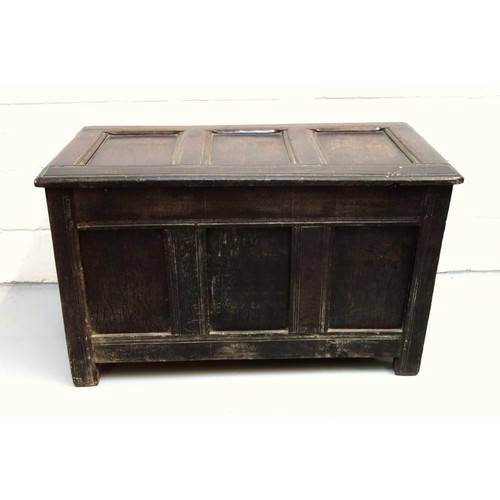 250 - 17th Century carved oak chest with a triple diamond panelled front and a hinged triple panelled top,... 