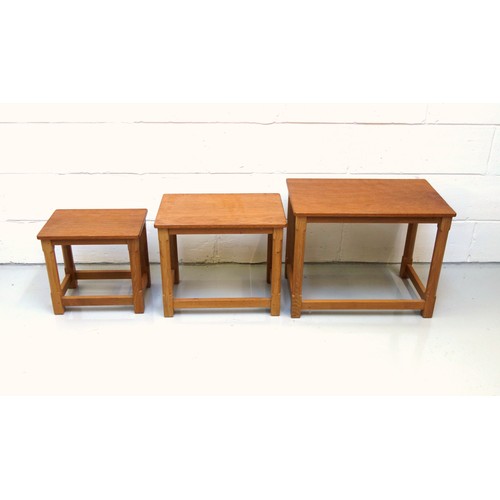 254 - Mouseman, (Robert Thompson), oak nest of three graduating rectangular tables, each with an adzed top... 