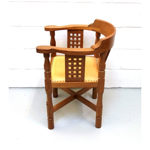 255 - Mouseman, (Robert Thompson), oak armchair curved back, carved lattice panels, and tan leather seat o... 