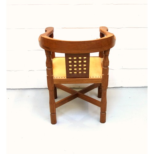 255 - Mouseman, (Robert Thompson), oak armchair curved back, carved lattice panels, and tan leather seat o... 