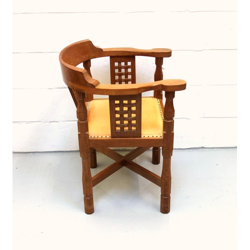 255 - Mouseman, (Robert Thompson), oak armchair curved back, carved lattice panels, and tan leather seat o... 