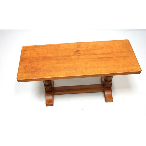 256 - Mouseman, (Robert Thompson), oak coffee table with a adzed rectanglar top, on octagonal baluster sup... 