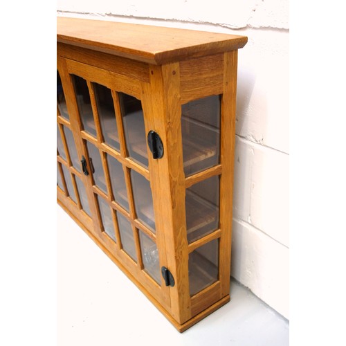 259 - Knightman, (Horace Knight, Old Mill Furniture), oak wall cabinet with 2 glazed doors and sides, the ... 