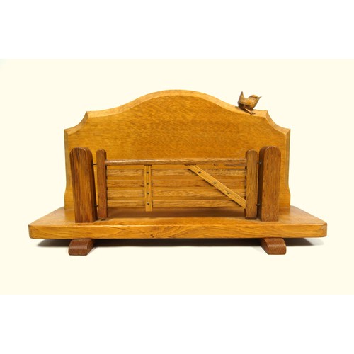 260 - Wrenman, (Bob Hunter, Thirlby), oak letter rack, the shaped serpentine back with carved wren tradema... 