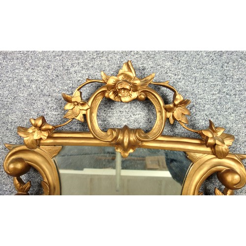 266 - Wall Mirror with a shield shaped plate in a gilt floral and scroll decorated frame 83 x 69cm overall