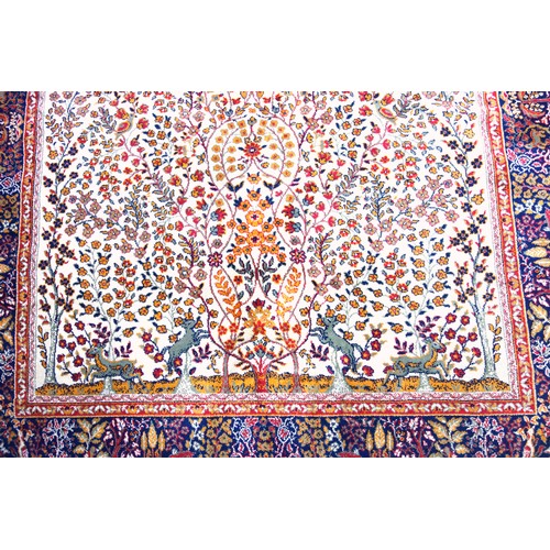 271 - Persian prayer rug, the ivory field with a tree of life with all-ver flowers, deer and birds, surrou... 