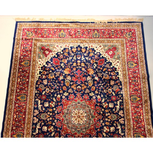 272 - Persian Tabriz carpet, the indigo field with a central medallion and all-over stylised floral decora... 