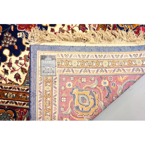 272 - Persian Tabriz carpet, the indigo field with a central medallion and all-over stylised floral decora... 