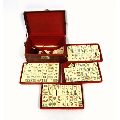 341 - Chinese Mahjong set with bone and bamboo tiles and counters, in a felt lined leather case, W.24.5cm