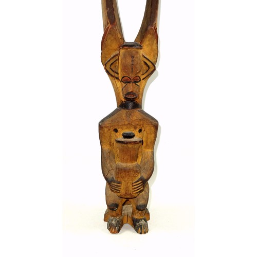 292 - 19th Century Nigerian Igbo Ikenga spiritual shrine figure, depicted seated holding a bottle with a p... 