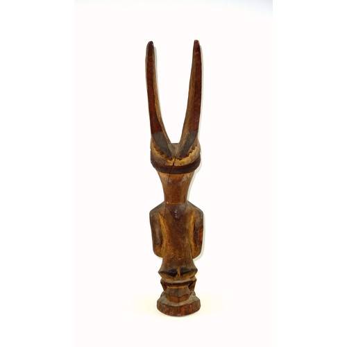 292 - 19th Century Nigerian Igbo Ikenga spiritual shrine figure, depicted seated holding a bottle with a p... 