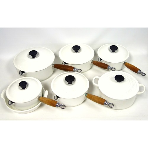 279 - Le Creuset set of 7 graduating white enamelled cast iron sauce pans, each with a spout, cover, and t... 