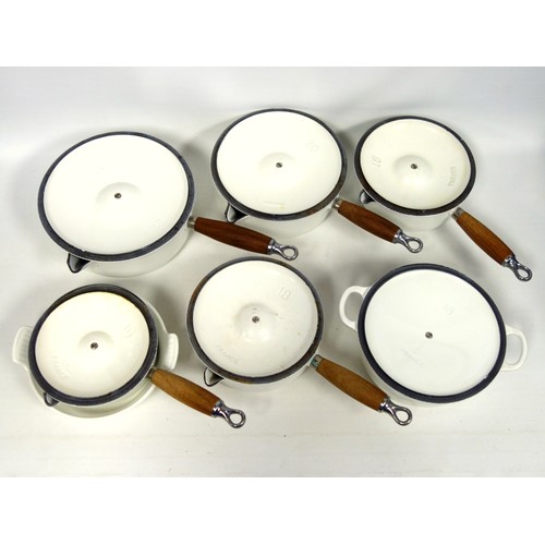 279 - Le Creuset set of 7 graduating white enamelled cast iron sauce pans, each with a spout, cover, and t... 