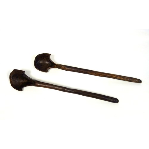 110 - Two similar large African hardwood tribal spoons, 52cm and 52.8cm respectively (2)