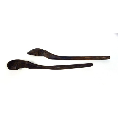 110 - Two similar large African hardwood tribal spoons, 52cm and 52.8cm respectively (2)