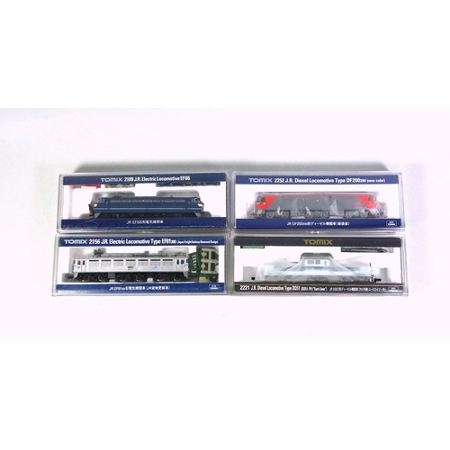 22 - 4 Tomix N Gauge diesel and electric locomotives, all in clear plastic cases. (4)