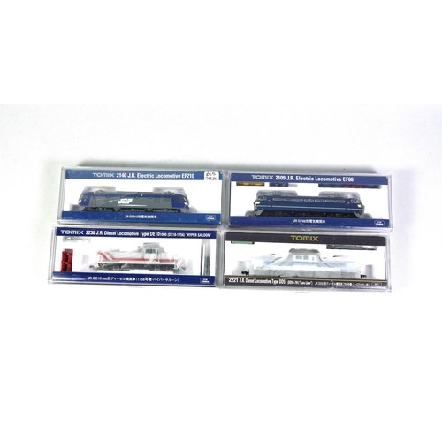 25 - 4 Tomix N Gauge diesel and electric locomotives, all in clear plastic cases. (4)