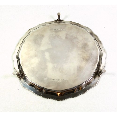 125 - Late Victorian silver salver with a scalloped and gadrooned rim on 3 hoof feet, by Carrington & Co.,... 